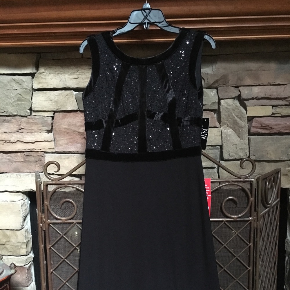 Long black dress with tags attached. Size 8.